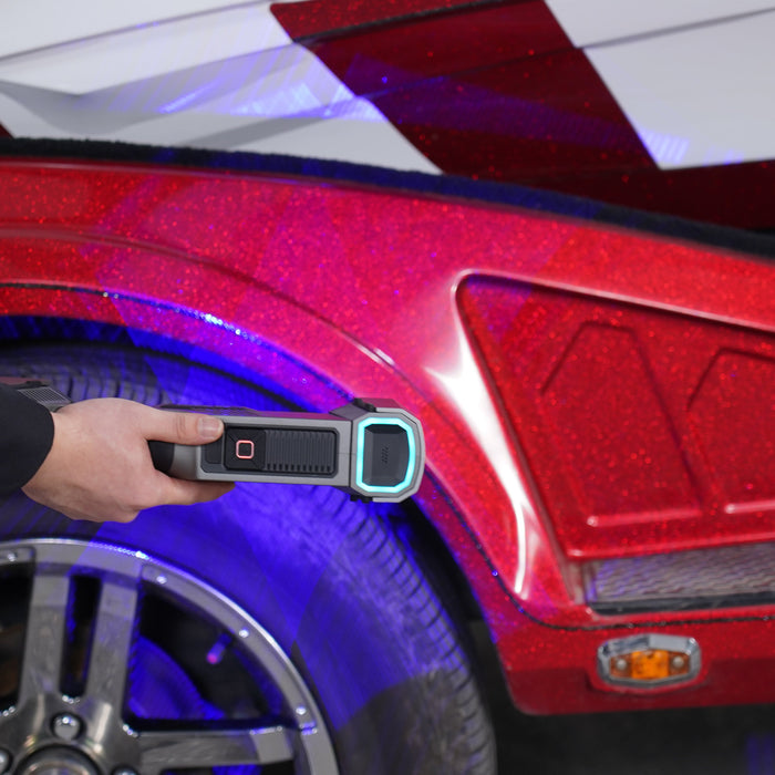 FreeScan Trio scanning a reflective red vehicle fender without markers