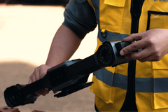 FreeScan UE Nova wireless scanner held by an operator