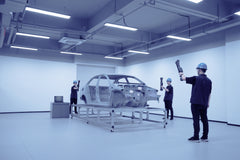 Operator scanning a vehicle body with FreeScan UE Nova